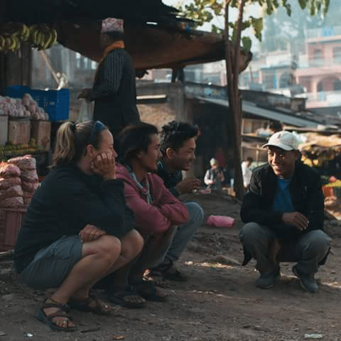 ( From Left to Right, Laura, Sunil, Suvash and Purna from the Join Adventures Team catching up after breakfast on route to the Bheri River, Nepal. photographer Owen Fisher)